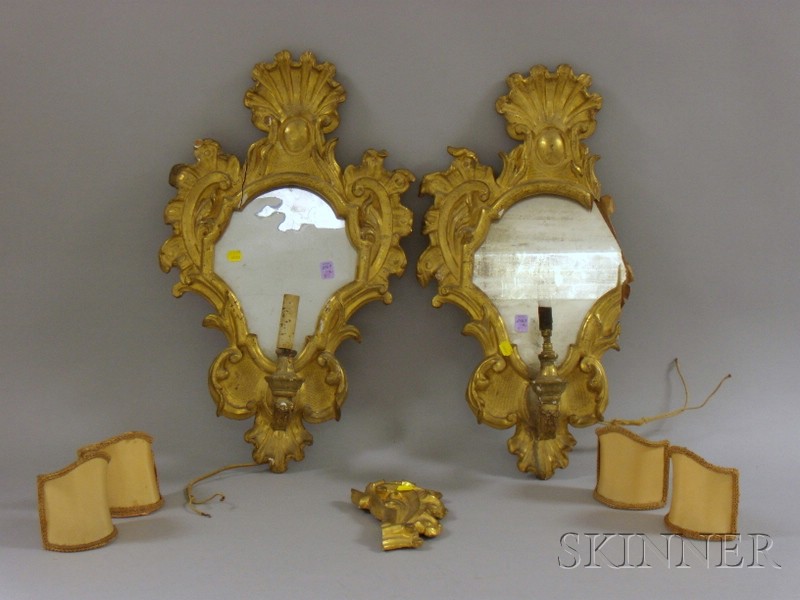 Appraisal: Pair of Rococo-style Carved Giltwood Mirrored Wall Sconces electrified damage