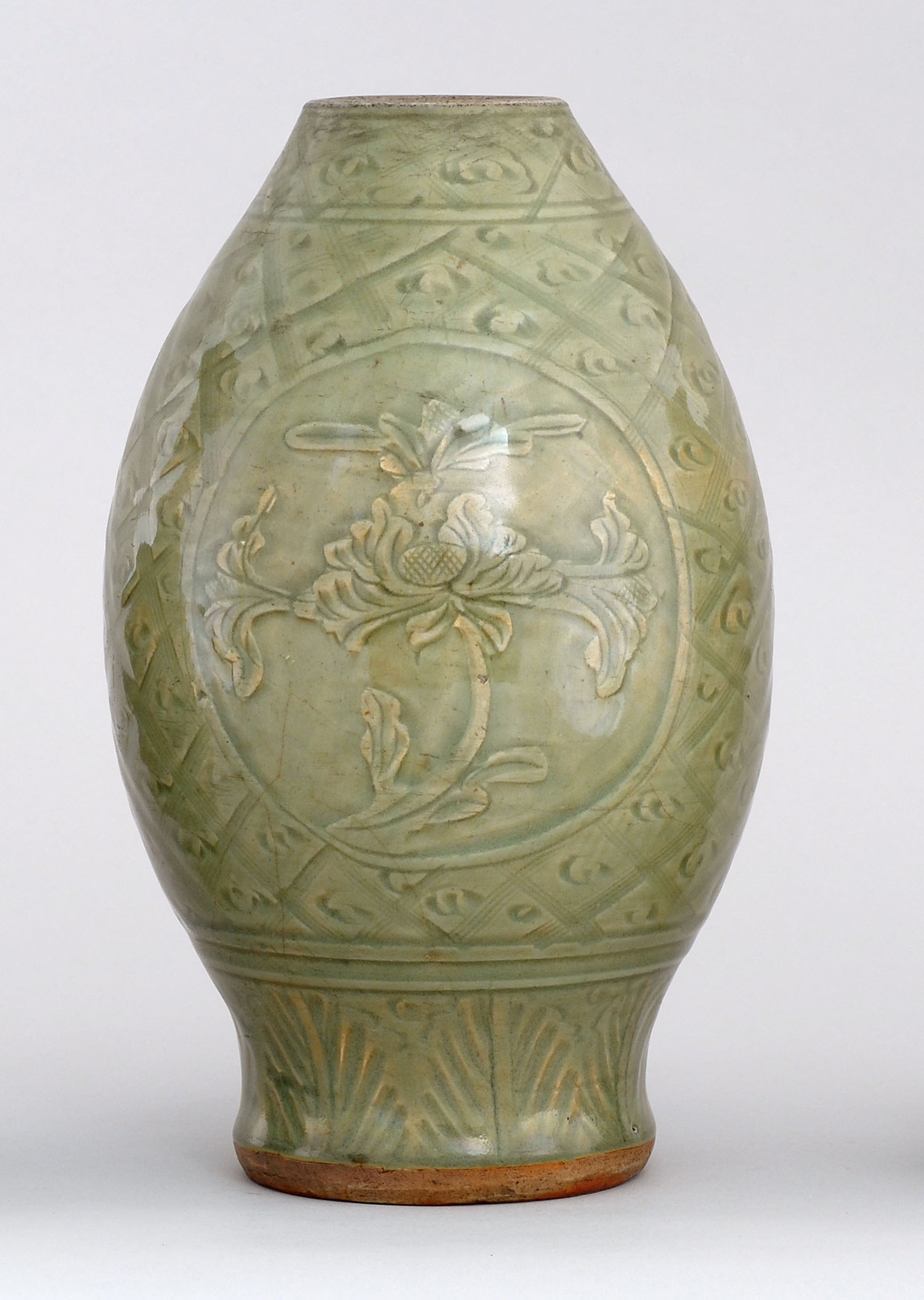 Appraisal: CELADON STONEWARE VASE th CenturyIn seed form with passionflower cartouches