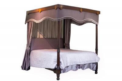 Appraisal: A th Century mahogany four-poster bed the reeded front posts