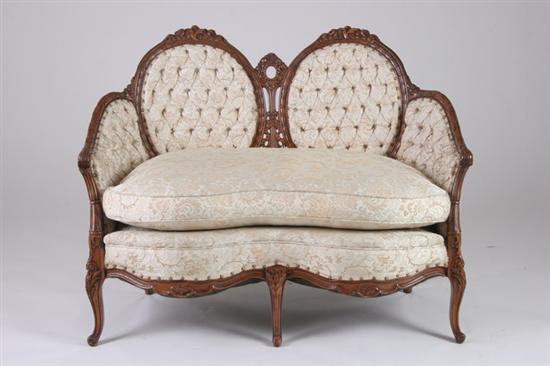 Appraisal: ROCOCO REVIVAL LOVE SEAT th century Carved crest rails button-tufted