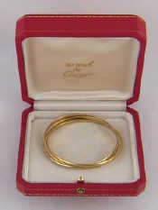 Appraisal: Cartier A three colour carat gold bangle by Cartier signed