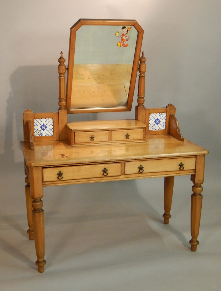 Appraisal: A Victorian ash dressing table the raised back with a