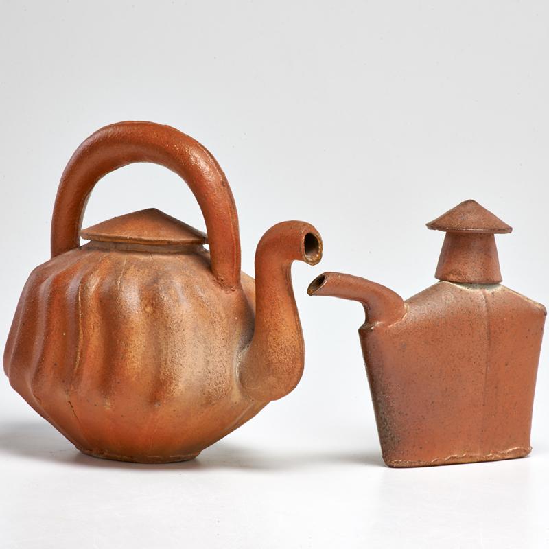 Appraisal: MARK PHARIS Two teapots USA s Glazed earthenware Unmarked Taller