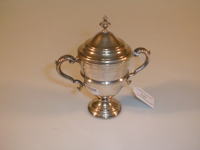 Appraisal: A silver two handled trophy cup and cover engraved British