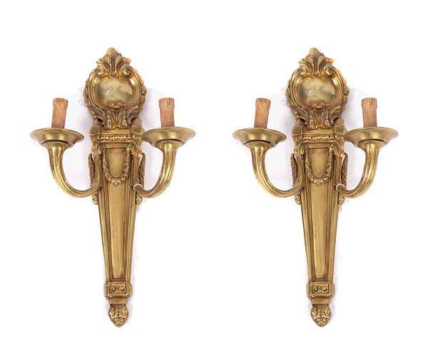 Appraisal: A pair of Louis XVI style gilt bronze two light