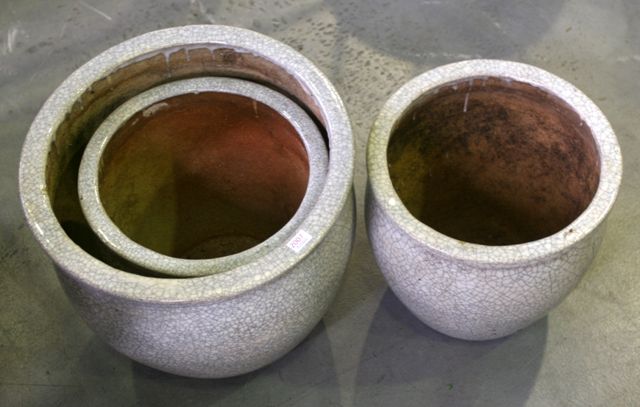 Appraisal: A set of three various sized planters grey crackle glaze