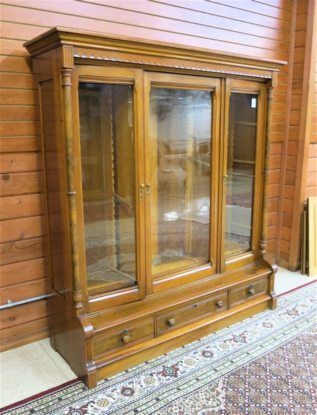 Appraisal: A VICTORIAN WALNUT CABINET BOOKCASE American c the interior divided