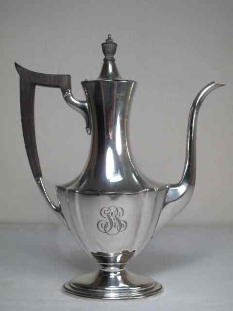 Appraisal: A sterling silver demitasse coffee pot with ebonized wood handle