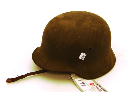 Appraisal: German WWII M Army rolled edge combat helmet Complete with