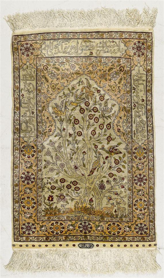 Appraisal: HEREKE PRAYER White mihrab with beige spandrels patterned with plants