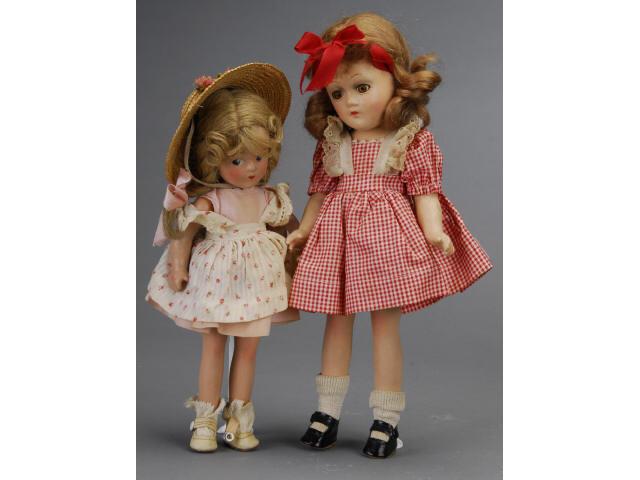 Appraisal: Lot Two Madame Alexander Composition Dolls America ca largest is