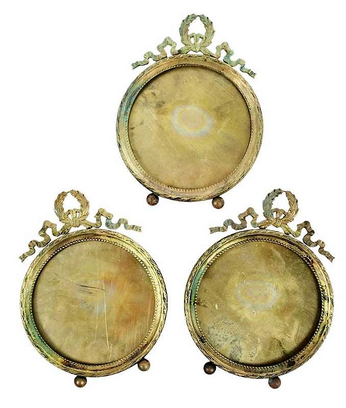 Appraisal: French Round Bronze Frames French th century Louis XVI style