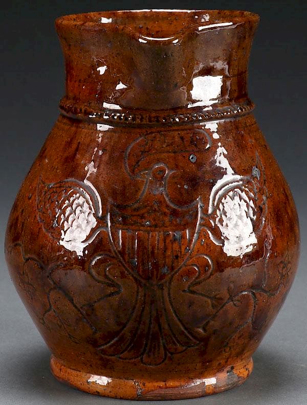 Appraisal: A FINE REDWARE EAGLE PITCHER CIRCA A FINE REDWARE EAGLE