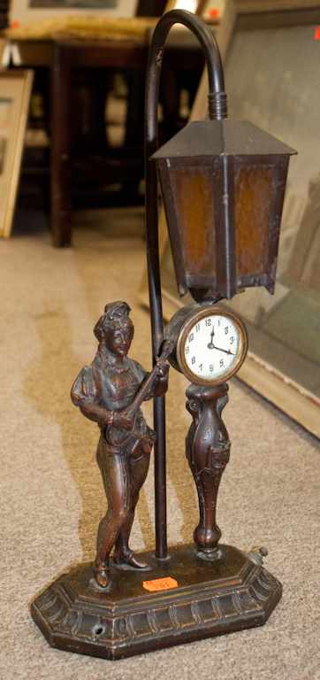 Appraisal: Patinated metal figural clock desk lamp Estimate - No condition