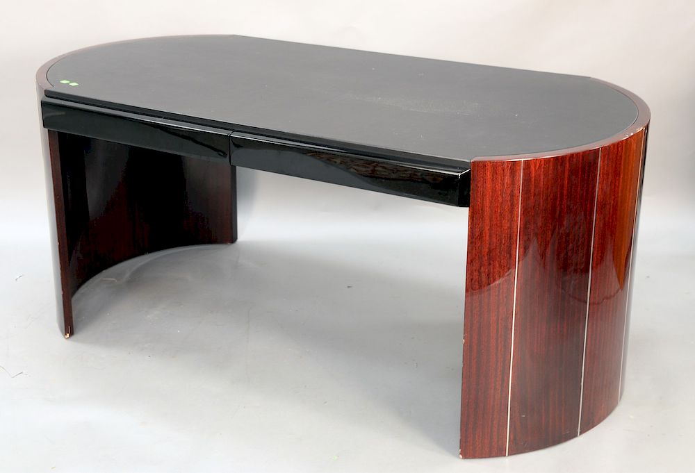 Appraisal: Contemporary modern desk having shaped leather top over high gloss