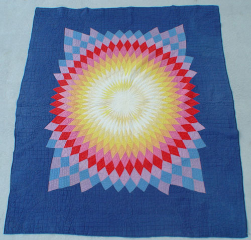 Appraisal: 'KANSAS SUN RISE'' STAR QUILT Vibrant colors bears a tag