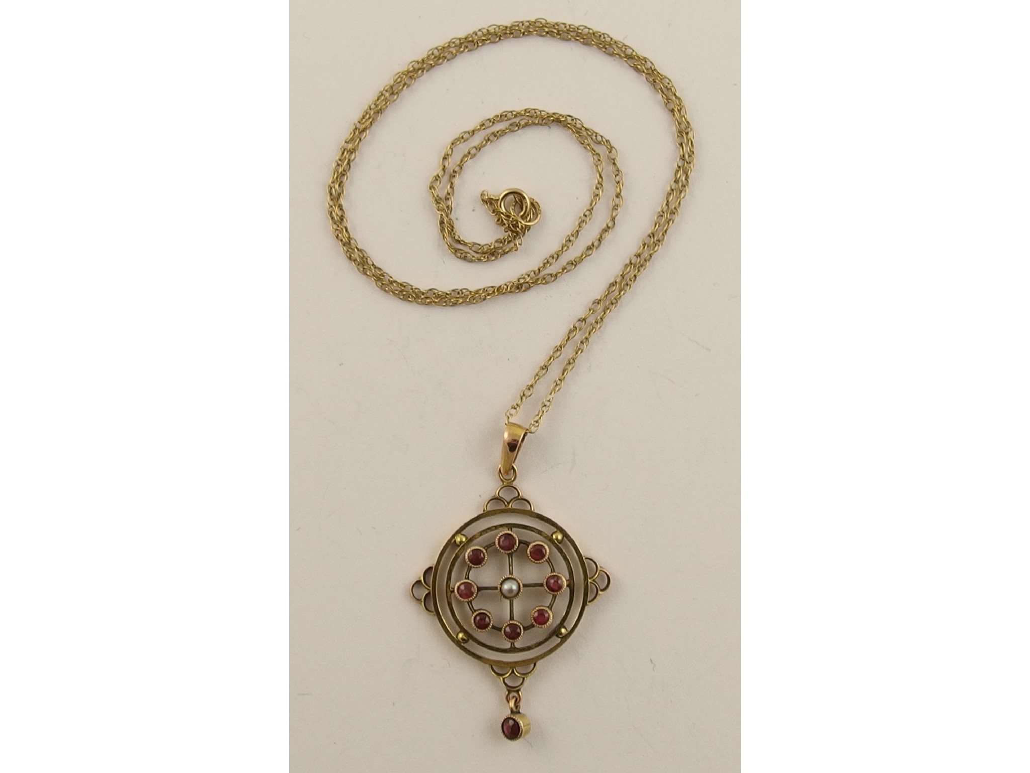 Appraisal: A ct Edwardian pearl and pink gem stone pendant with