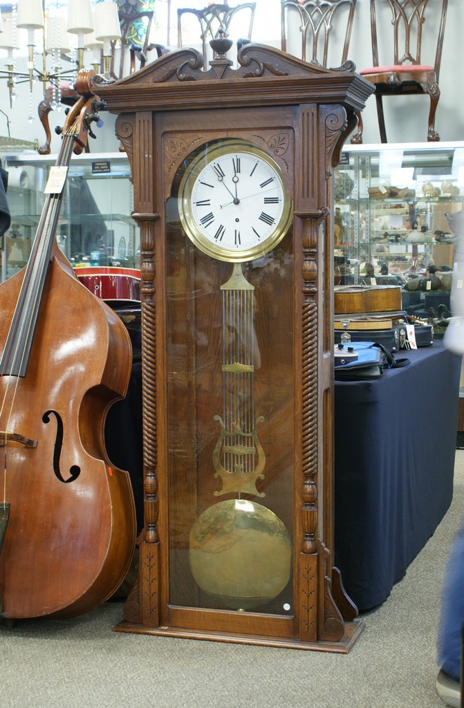 Appraisal: Carved oak jewelers pinwheel regulator fitted with a Swiss brass