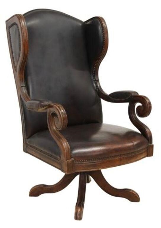 Appraisal: EXECUTIVE WINGBACK LEATHER SWIVEL OFFICE CHAIRExecutive wingback swivel armchair th