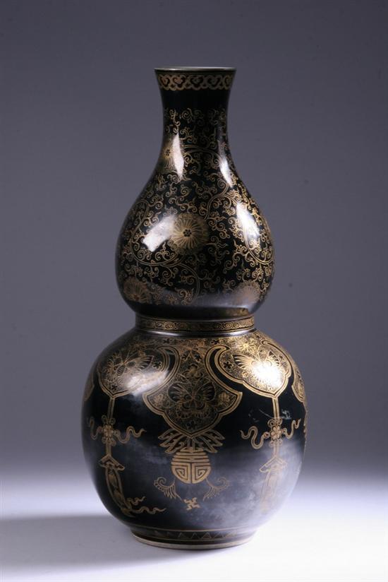 Appraisal: CHINESE MIRROR BLACK AND GILT DOUBLE-GOURD PORCELAIN VASE Late Qing