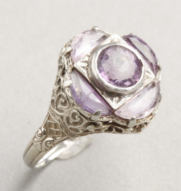 Appraisal: KW one round amethyst at center four additional moon shaped