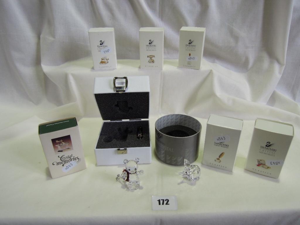 Appraisal: A collection of boxed Swarovski crystal items including a skiing