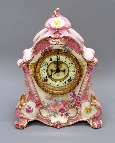 Appraisal: Rococo cresting porcelain dial with exposed escapement floral painted brass