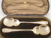 Appraisal: A cased pair of silver engraved serving spoons Jackson and