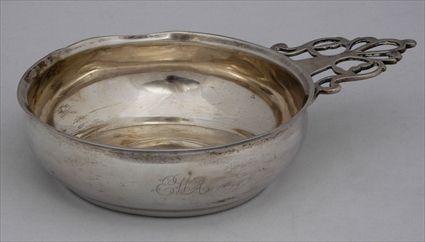 Appraisal: AMERICAN SILVER PORRINGER Unmarked the swelling bowl with everted rim