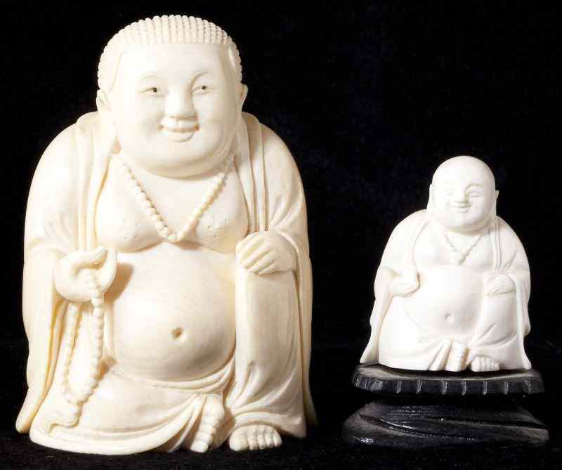 Appraisal: Two Asian Seated Ivory Buddha Figuresthe smaller one mounted on