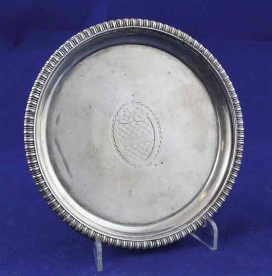 Appraisal: A George III silver circular teapot stand with gadrooned border