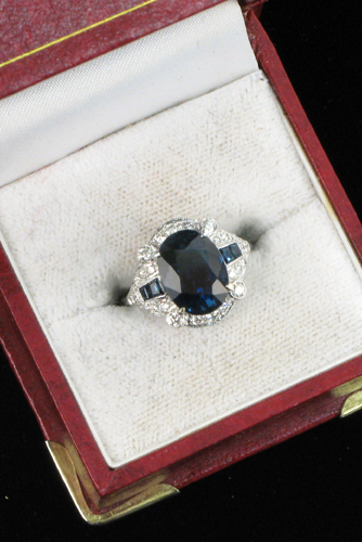 Appraisal: SAPPHIRE DIAMOND AND EIGHTEEN KARAT WHITE GOLD RING centering a