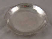 Appraisal: A Chinese silver circular dish with shaped rim and hammered