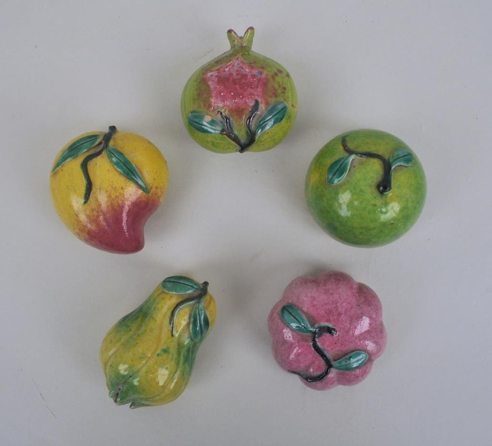 Appraisal: Five Chinese Porcelain Enameled Fruits including a mango and pomegranate