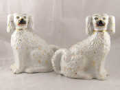 Appraisal: A pair of white ceramic Staffordshire flat back spaniels approx