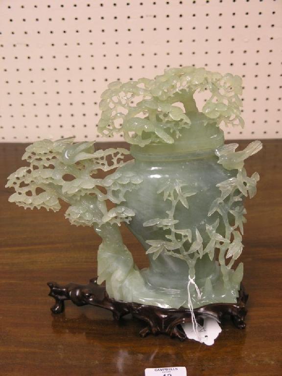 Appraisal: A Chinese jade vase and cover finely carved on wood