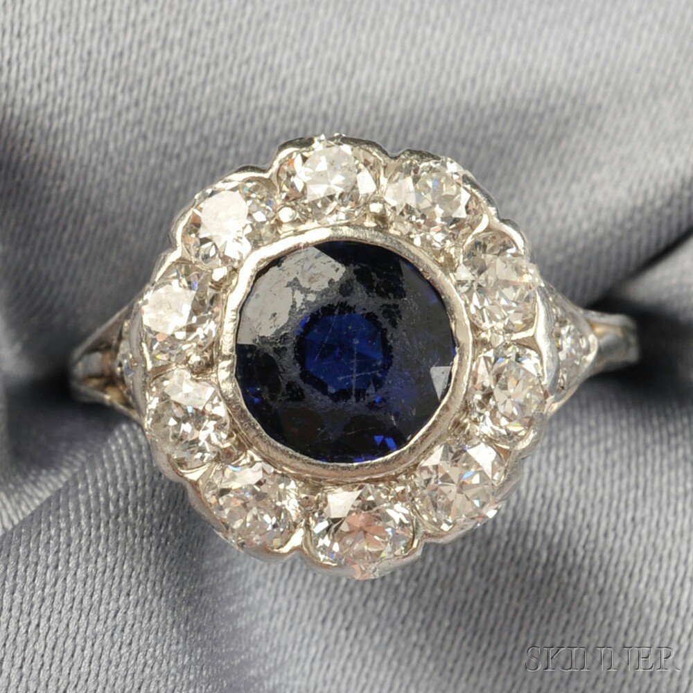 Appraisal: Platinum Synthetic Sapphire and Diamond Ring bezel-set with a circular-cut