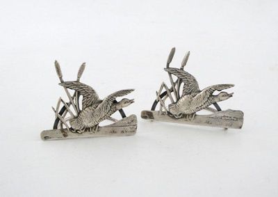 Appraisal: A pair of Edwardian novelty silver menu card holders modelled