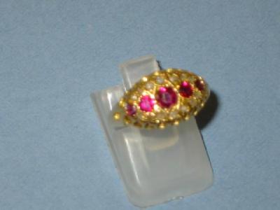 Appraisal: A VICTORIAN RUBY AND DIAMOND RING comprising a row of