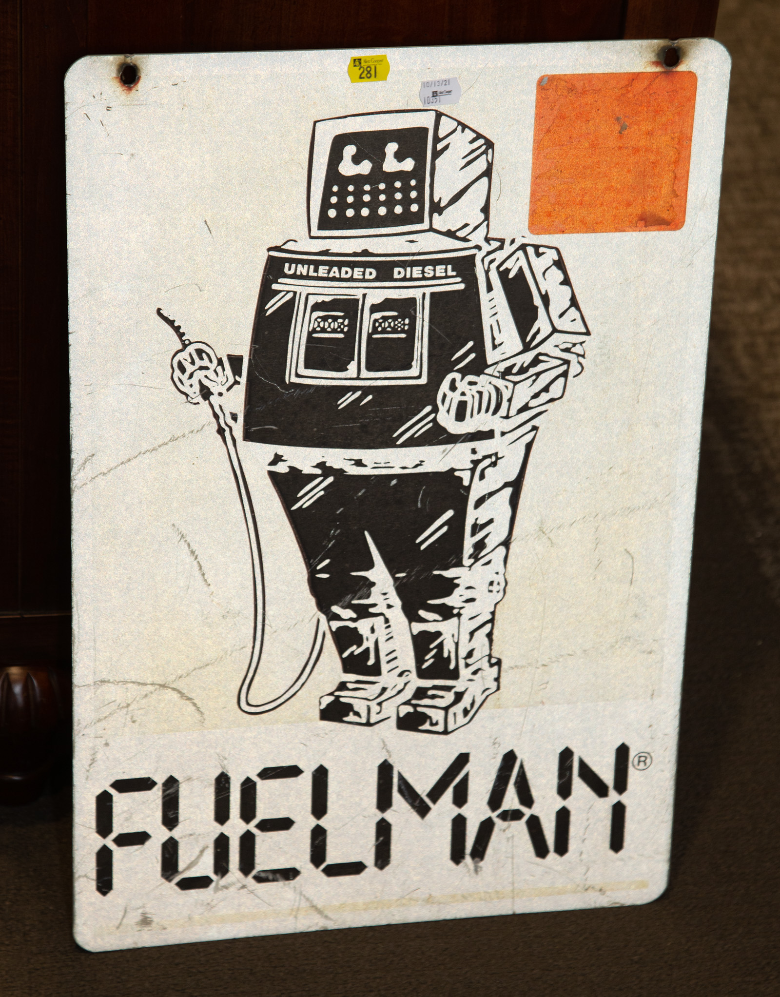 Appraisal: FUEL MAN DOUBLE SIDED METAL SIGN in H in W