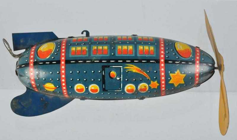 Appraisal: Tin Litho Space Rocket Wind-Up Toy German Working Original propeller