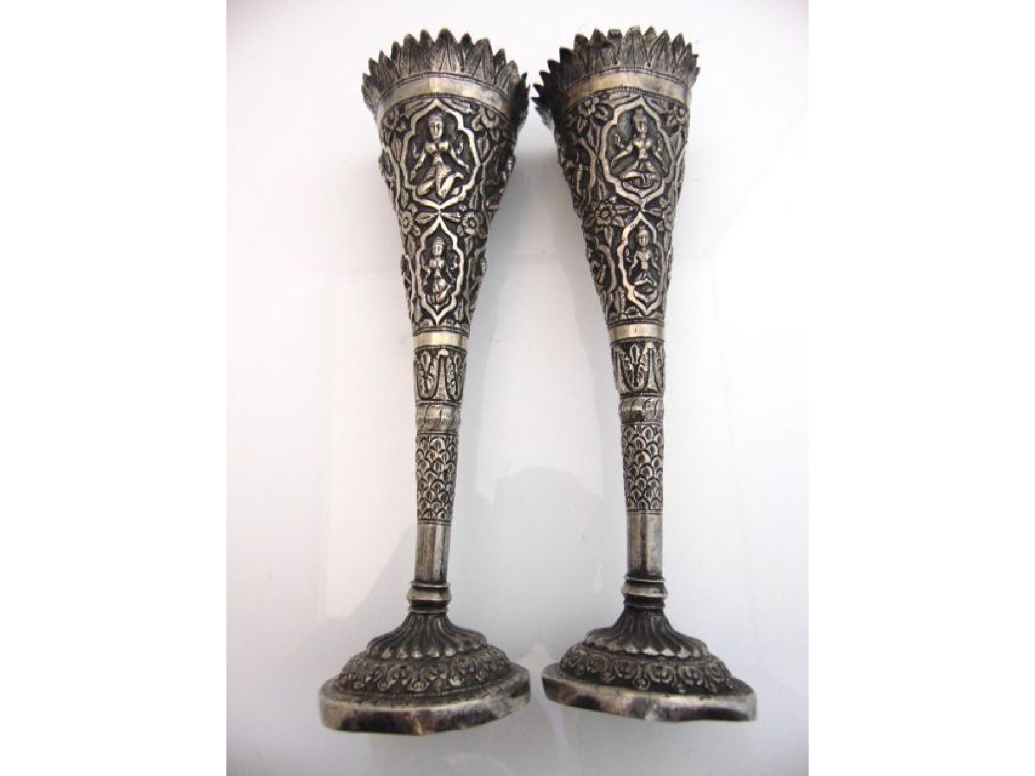 Appraisal: A pair of white metal post vases each with Hindu