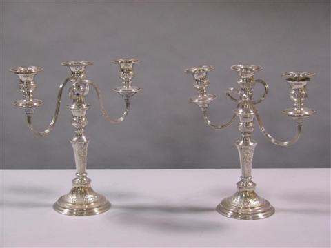 Appraisal: PAIR OF PETITE SHEFFIELD PLATE CANDLESTICKS With matching three-light arms