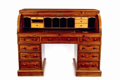 Appraisal: An early Victorian mahogany twin pedestal cylinder desk with a