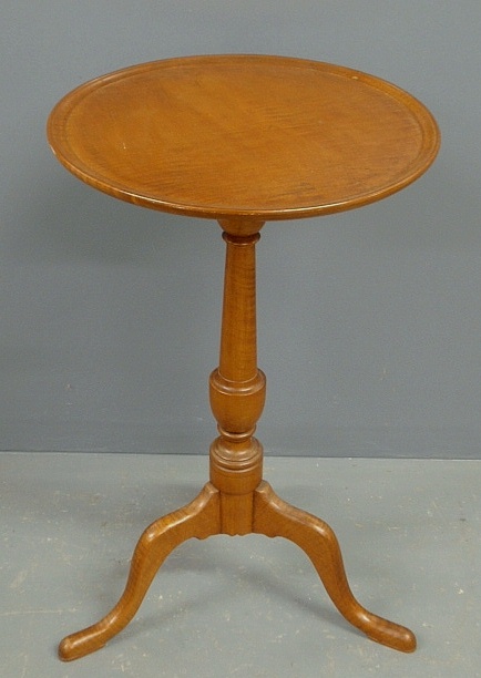 Appraisal: - Queen Anne style tiger maple candlestand with an urn-turned