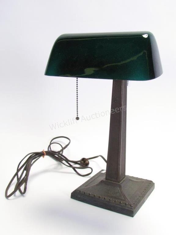 Appraisal: An antique Verdelite student lamp with green glass shade bronze