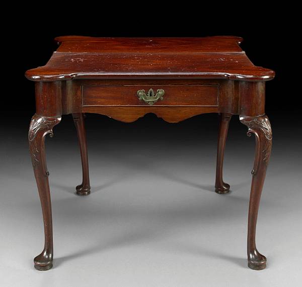 Appraisal: A George II carved mahogany fold top games table mid