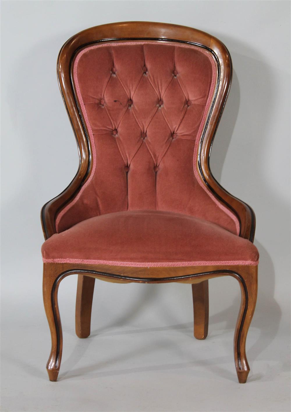 Appraisal: VICTORIAN STYLE UPHOLSTERED MAHOGANY PARLOR CHAIR having a rounded and