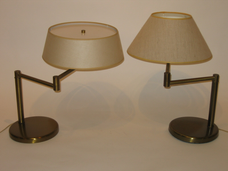 Appraisal: WALTER VON NESSEN NEW YORK Pair swing-arm bronze-tone table lamps