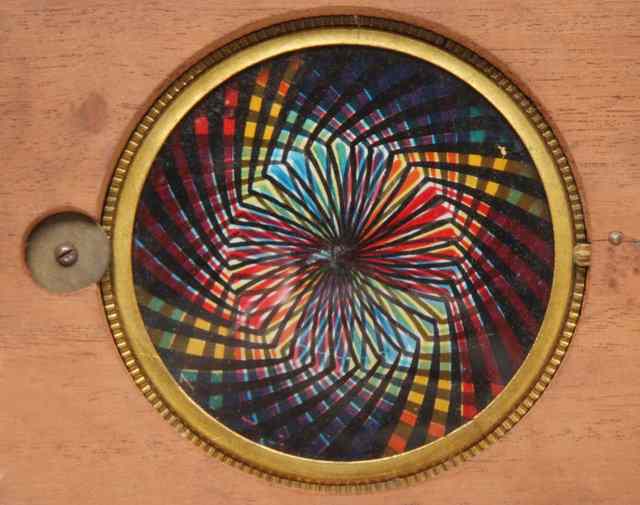 Appraisal: A VICTORIAN AUTOMATON KALEIDOSCOPIC MAGIC LANTERN SLIDE wide